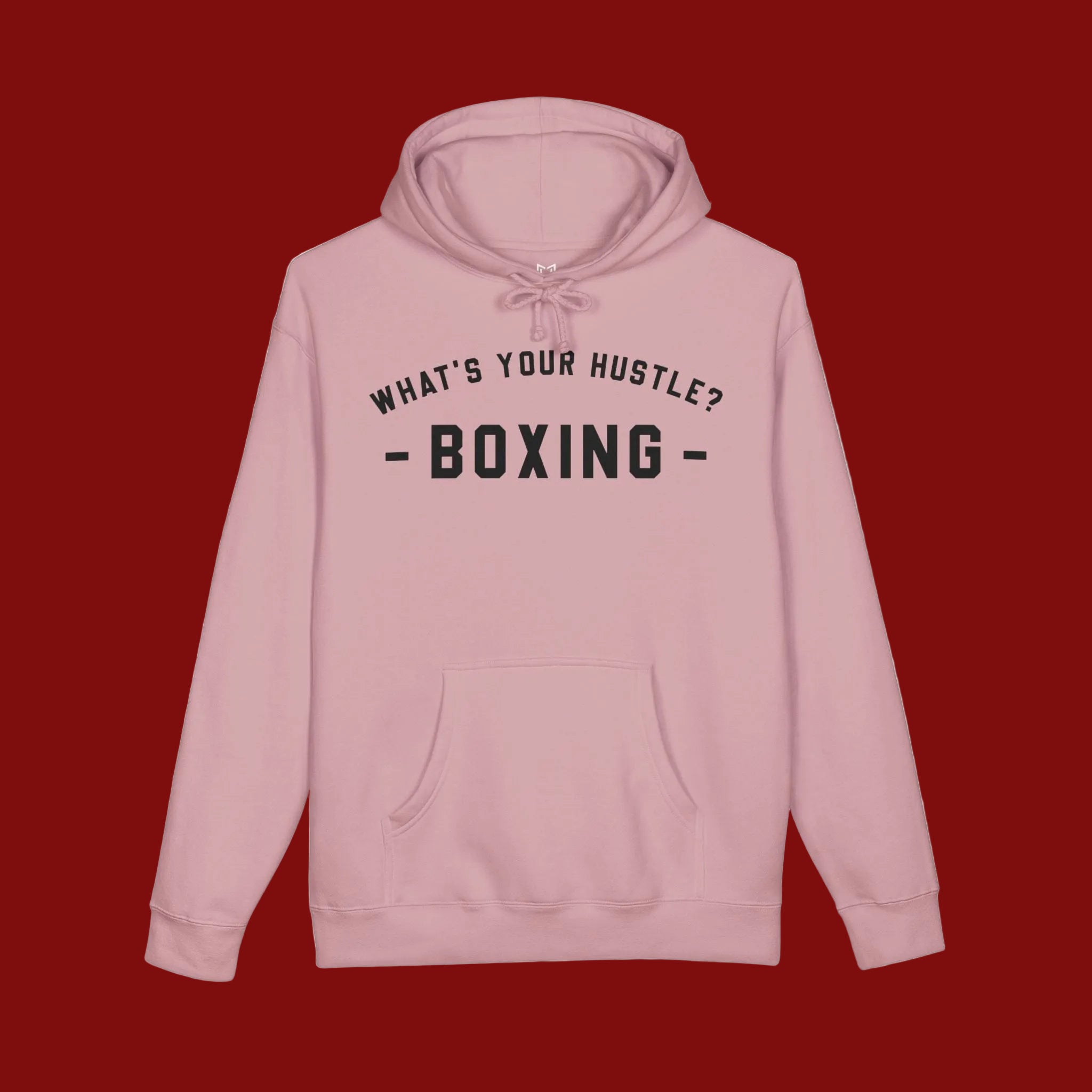 A light pink pullover hoodie with black text on the chest reading 'WHAT'S YOUR HUSTLE? - BOXING -', displayed against a solid white background.